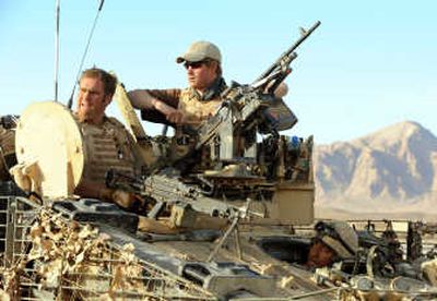 
Britain's Prince Harry, right, sits  atop a military vehicle in Afghanistan's Helmand province Feb. 18.Associated Press
 (Associated Press / The Spokesman-Review)
