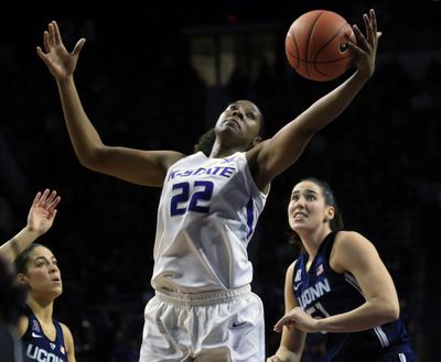 Kansas State forward Breanna Lewis, center, rebounds against Connecticut guard Kia Nurse, left, and center Natalie Butler during the second half of an NCAA college basketball game in Manhattan, Kan., Sunday, Dec. 11, 2016. (Orlin Wagner / Associated Press)