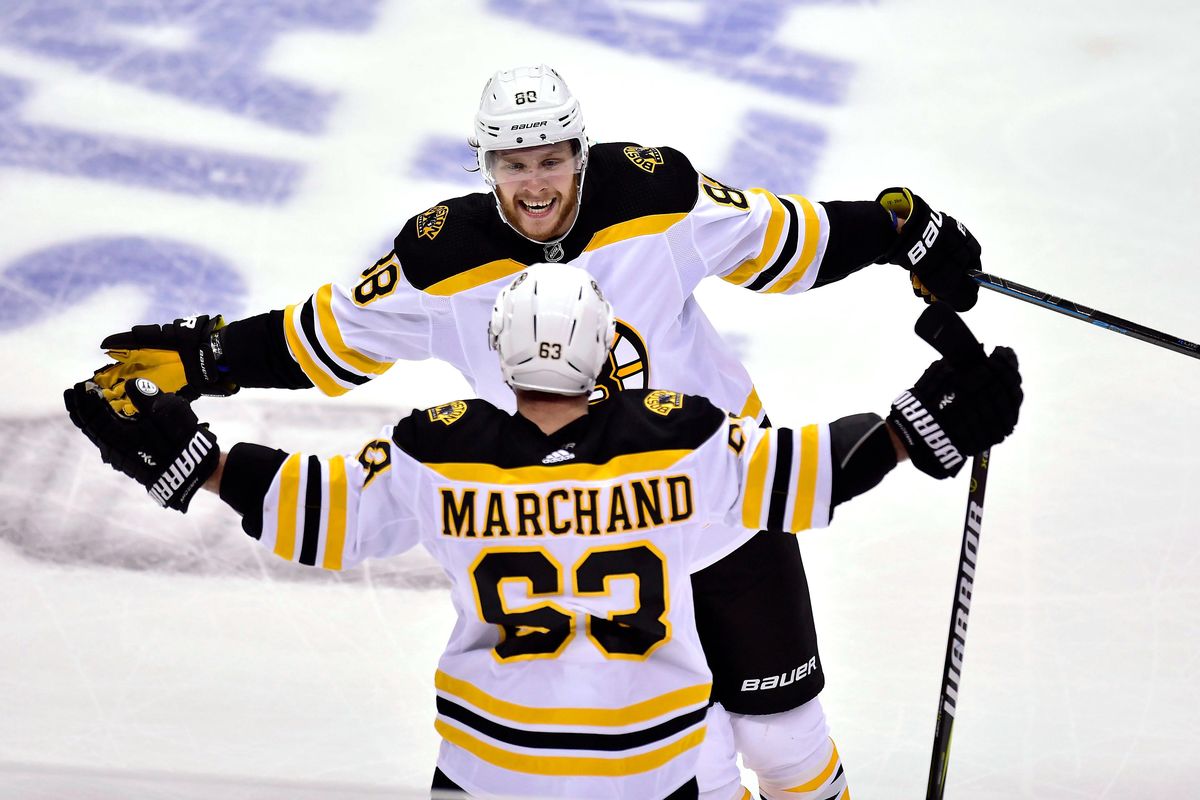 Boston Bruins left wing Brad Marchand (63) celebrates his goal against the Toronto Maple Leafs with teammate David Pastrnak (88) during the second period of Game 4 of an NHL hockey first-round playoff series Thursday, April 19, 2018, in Toronto. (Frank Gunn/The Canadian Press via AP) ORG XMIT: DPI530 (Frank Gunn / AP)