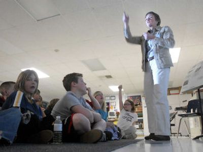 
Kim Brown from the Post Falls Historical Society speaks to a group of fourth-graders at Ponderosa Elementary, where the kids hope to start a mural project about famous people in Post Falls history. 
 (Jesse Tinsley / The Spokesman-Review)