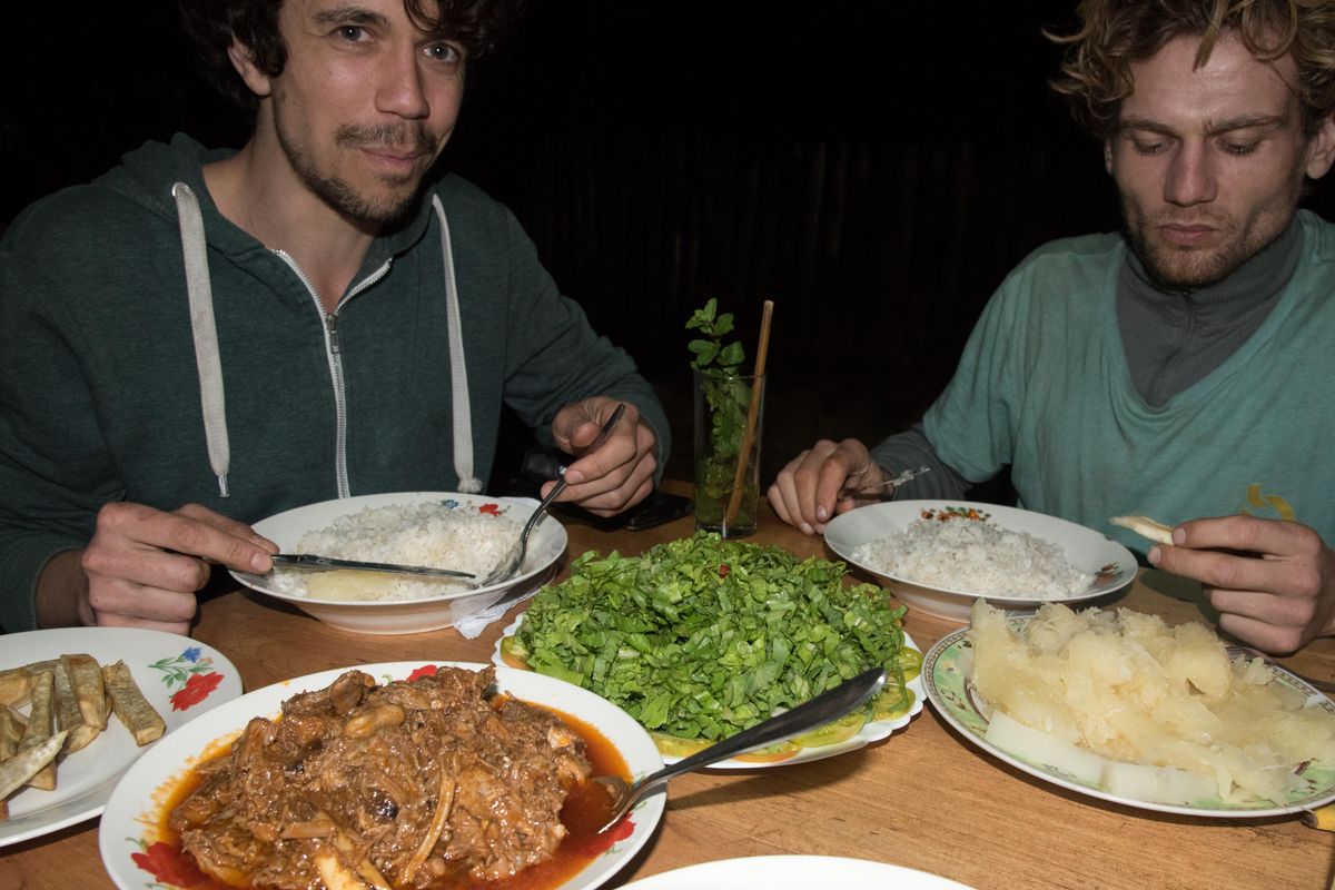 Freek Borlee and Daan Smit enjoy a meal of ropa vieja in Vinales, Cuba. (Eli Francovich / The Spokesman-Review)