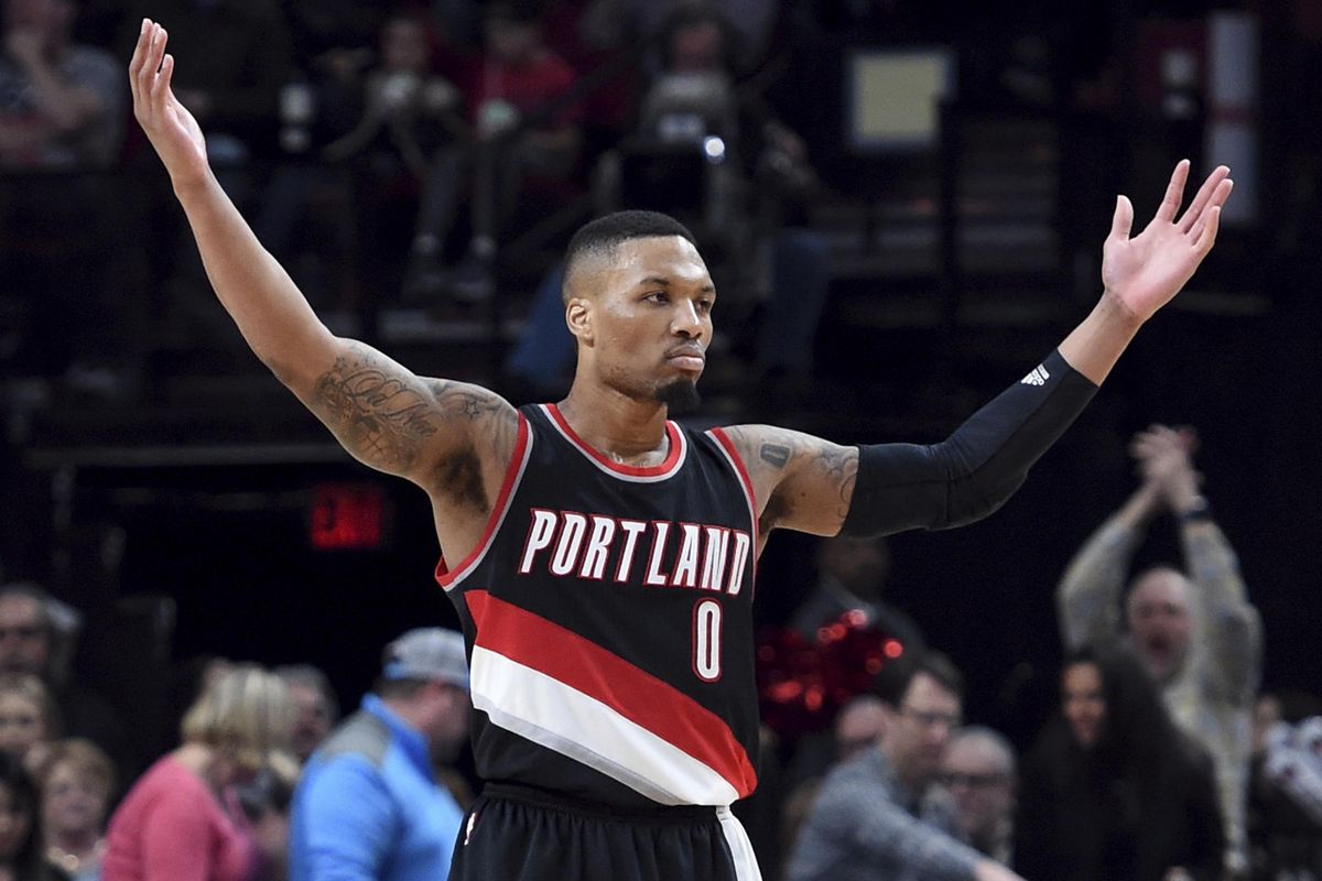 Portland Trail Blazers guard Damian Lillard acknowledges the crowd during the  team’s NBA game against the visiting Utah Jazz last  April.  Lillard scored a franchise-record 59 points as the Blazers won 101-86. (Steve Dykes / Associated Press photos)