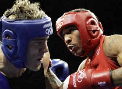 
Andre Ward, right,  throws a punch to Italy's Clemente Russo during light-heavyweight bout. 
 (Associated Press / The Spokesman-Review)