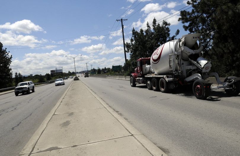 A Central Pre-Mix truck heads south on Sullivan Road over the Spokane River on Thursday.  (J. Bart Rayniak)
