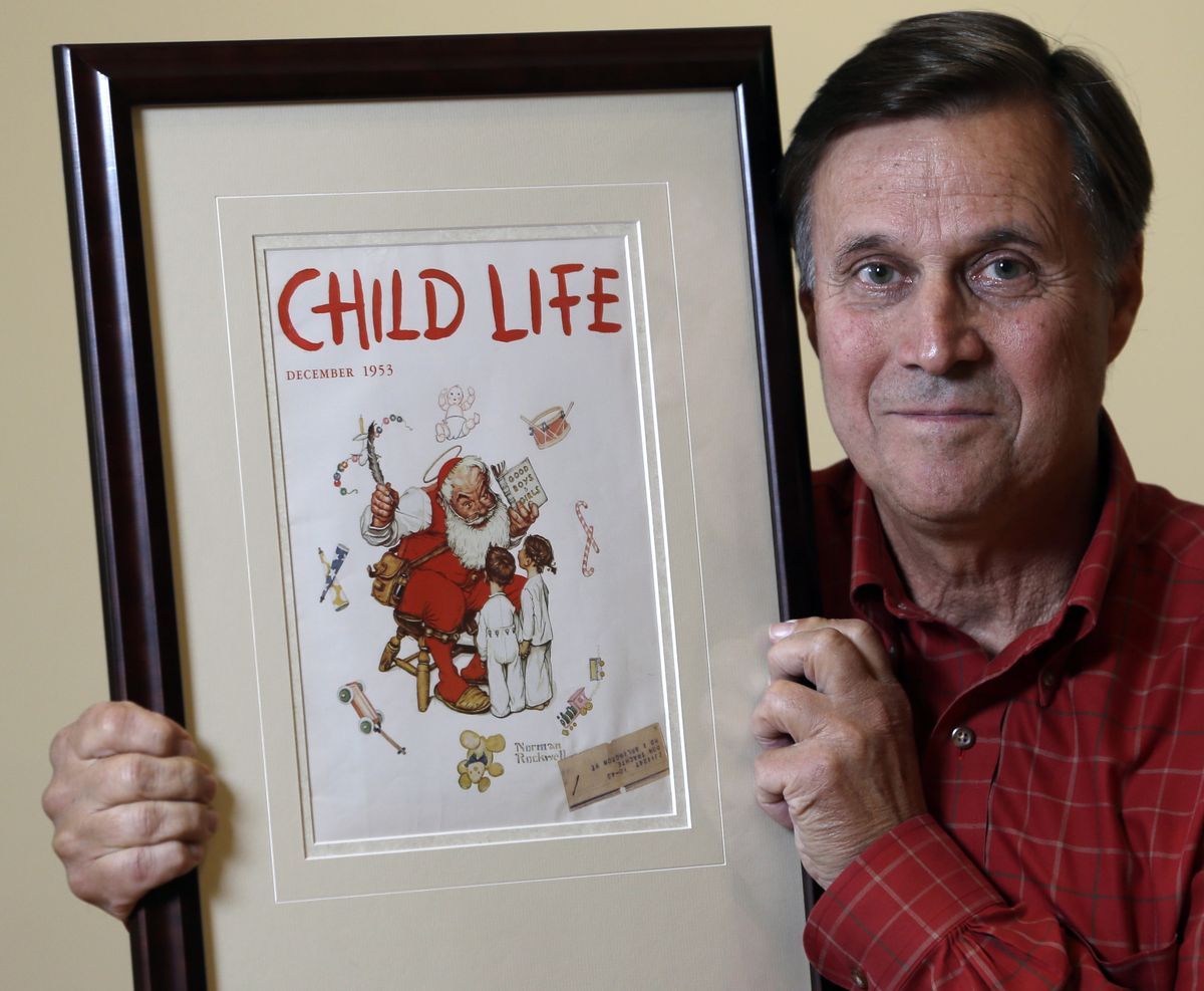 Don Trachte of Bennington, Vt., poses with a1953 Child Life magazine cover illustration "Santa