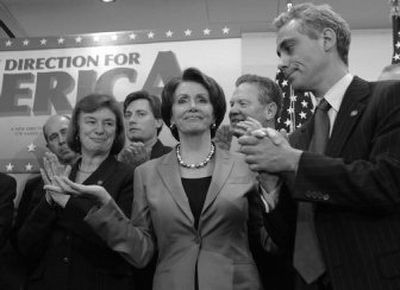 
House Speaker Nancy Pelosi, of California, center, and fellow Democratic House members applaud their work during the first 100 hours of the 110th Congress  in Washington on Thursday.
 (Associated Press / The Spokesman-Review)