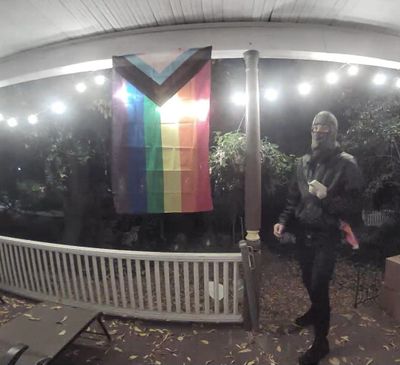 Ring camera footage from Spokane City Council candidate Paul Dillon’s home shows a person ripping a Pride flag from his porch and running away with it.  (Courtesy of Paul Dillon)