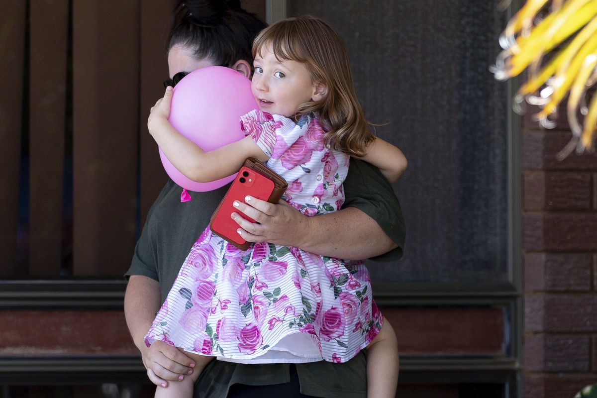 Cleo Smith, right, and her mother Ellie Smith leave a house where they spent the night after 4-year-old Cleo was rescued in Carnarvon, Australia, Thursday, Nov. 4, 2021. Police expected to charge a local man with abducting Cleo from her family