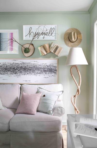 Brian Patrick Flynn decorated this living room with soft neutral tones including mossy green and pale pink, and he kept the furniture light and casual by sticking with breathable fabrics such as cotton and linen. (Associated Press)