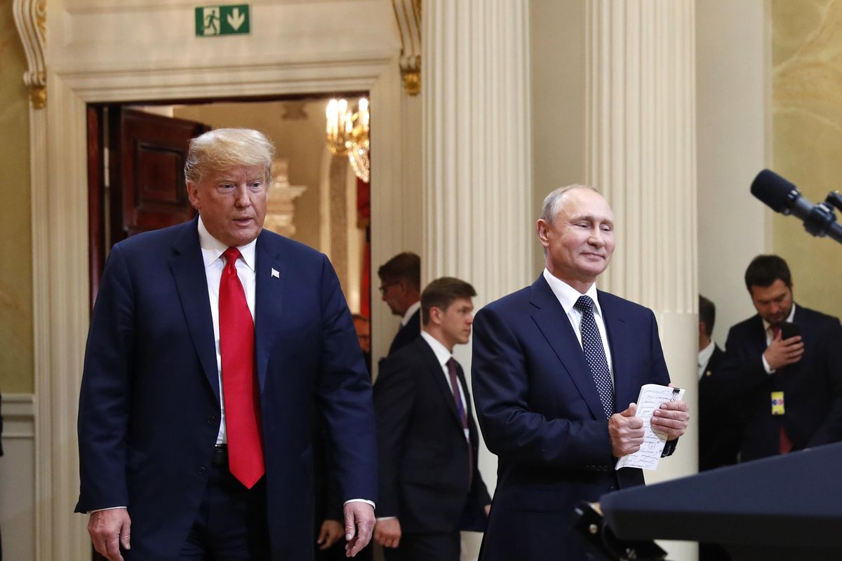 U.S. President Donald Trump, left, and Russian President Vladimir Putin arrive July 16, 2018, for a news conference at the Presidential Palace in Helsinki, Finland. (Pablo Martinez Monsivais / AP)