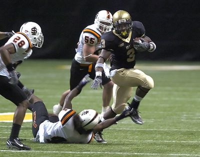 Idaho’s Deonte’ Jackson finds some running room outside.  (Associated Press / The Spokesman-Review)