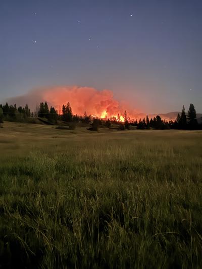 The glow from the Bradeen Fire is seen from the incident command post in Colville on July 25.  (Courtesy)