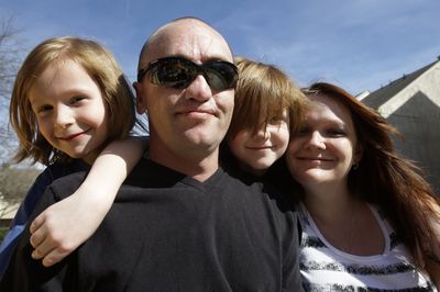 Sgt. Darron Mikeworth poses at home with his family in San Antonio on March 2. From left are his sons Ryan, 7,  Connor, 6, and wife, Dea.  (Associated Press / The Spokesman-Review)