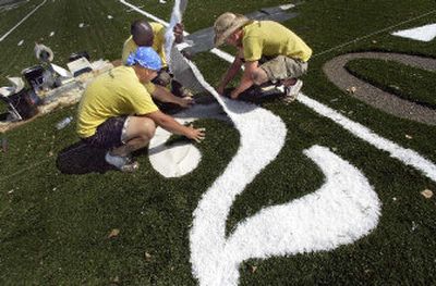 
From left, Monroe Jordan, Joel Jackson and Tyler Hall apply yard markers to new football field last week at Gonzaga Prep.
 (Christopher Anderson/ / The Spokesman-Review)