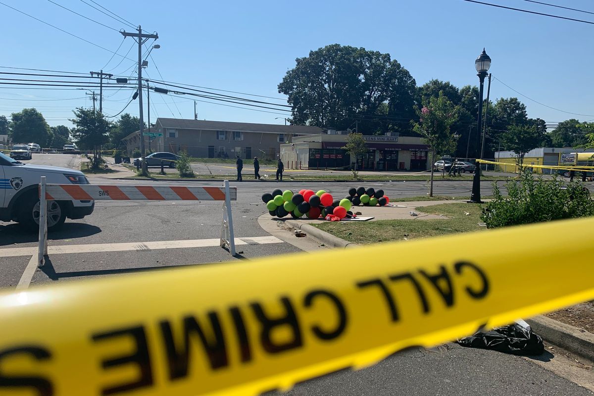 Police tape is seen near the scene of a shooting early Monday, June 22, 2020 in Charlotte, North Carolina, that resulted in two deaths and several more people wounded or injured. Police say a shooting in North Carolina