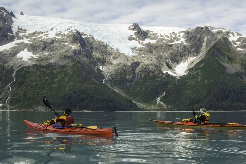 Sea-kayakers Lisa Helmbrecht and Susan Luchesi of Spokane explore Kenai Fjords National Park.  (Deb Pierce)