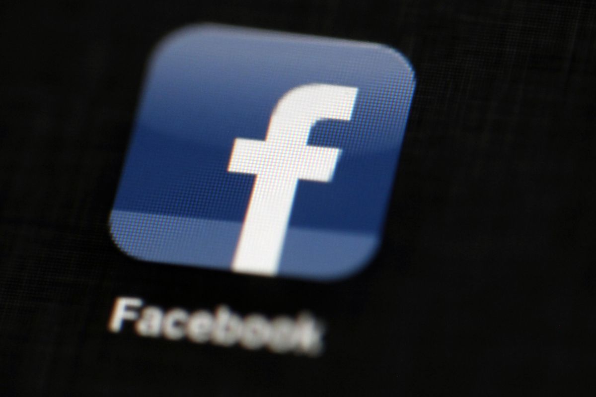 In this May 16, 2012, file photo, the Facebook logo is displayed on an iPad in Philadelphia. (Matt Rourke / Associated Press)