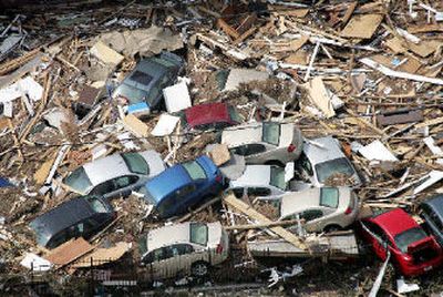 
Cars are piled up among debris from Hurricane Katrina on Wednesday in Gulfport, Miss. Katrina left most of the area devastated after making landfall on Monday. In Mississippi, officials expect the death toll to climb well above 100. Combined with the expected death toll of possibly thousands in other areas, it could be the worst natural disaster in the United States since the 1906 earthquake in San Francisco.
 (The Spokesman-Review)
