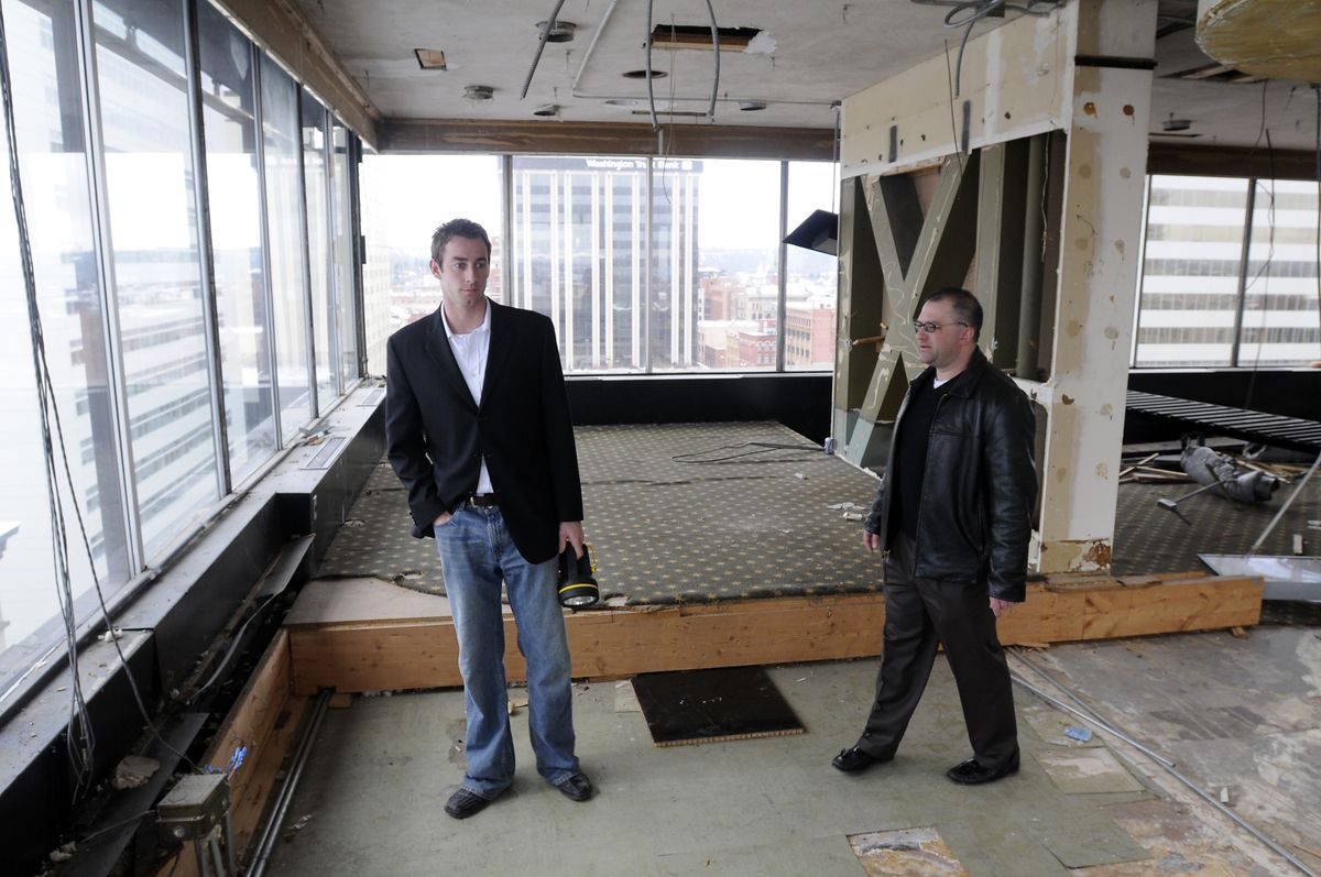 Jon Jeffreys, left, and Mark McLees of NAI Black, a commercial real estate firm, walk around the Ridpath Hotel penthouse Thursday.   (Photos by Jesse Tinsley / The Spokesman-Review)