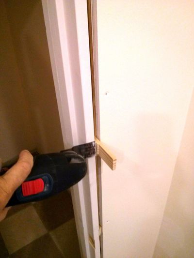 A vibrating multi-tool trims wood shims quickly and safely — ideal when you’re installing a door. (Tim Carter)