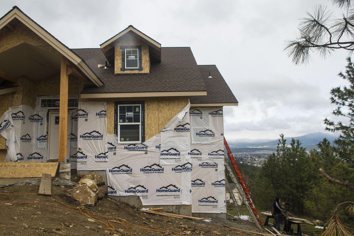 A construction crew works on a custom built home by Todd Sullivan on Del Rey Drive on Monday, April 16, 2018. As inventory is diminishing for homes on the real estate market, more people are gravitating toward building their own homes. Kathy Plonka/THE SPOKESMAN-REVIEW (Kathy Plonka / The Spokesman-Review)