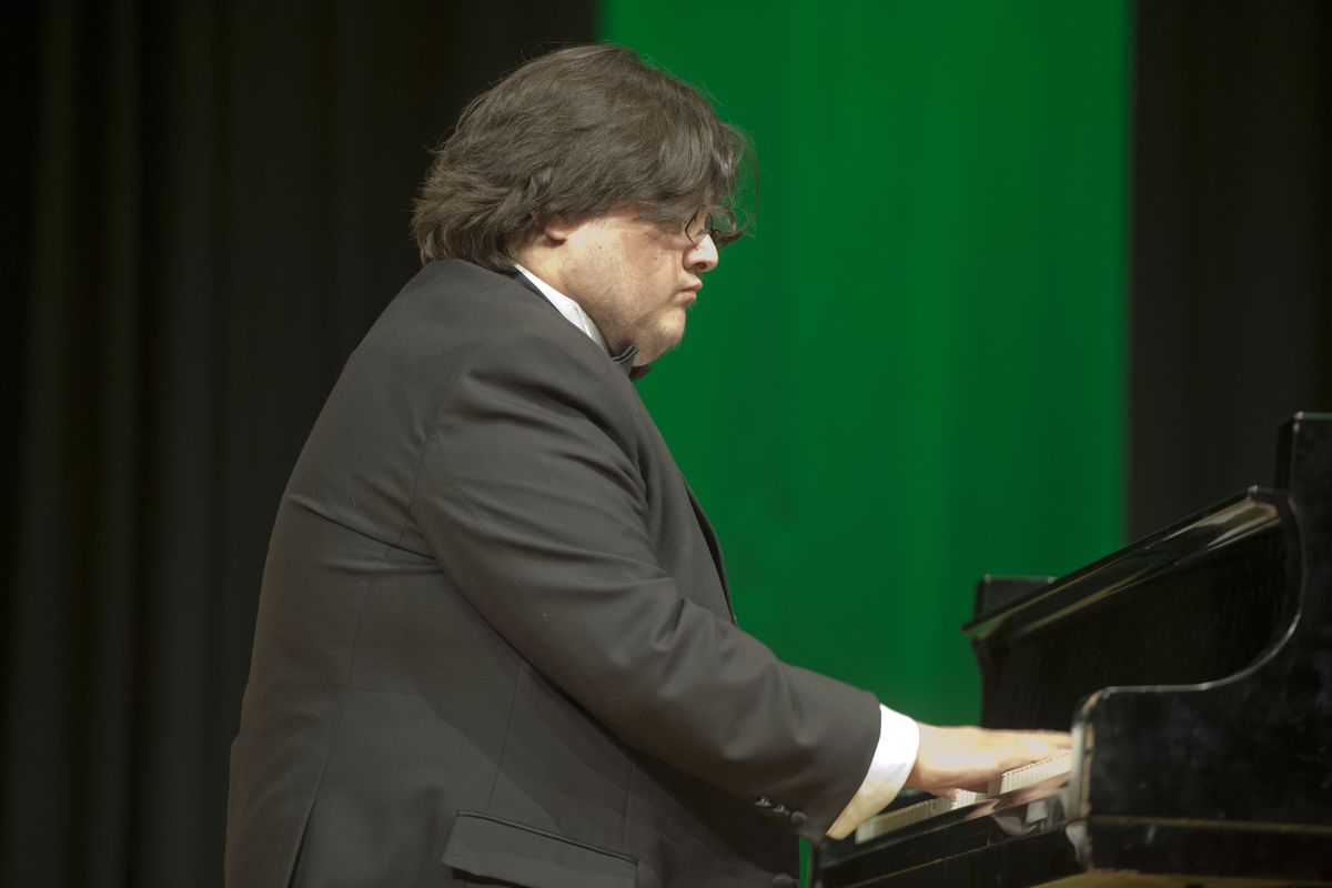 Piano student Rana Mahmood performs a piece by Frédéric Chopin during a Spokane Falls Community College spring recital on June 6. Mahmood, who is partially deaf, was a self-taught pianist until he enrolled at the community college. He’s headed to Gonzaga University. (Jesse Tinsley)