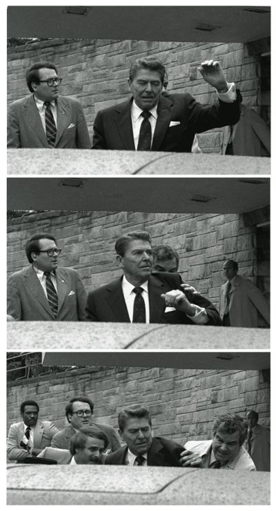 President Ronald Reagan is shoved into the presidential limousine by Secret Service agents after being shot outside a Washington hotel March 30, 1981. (Associated Press)