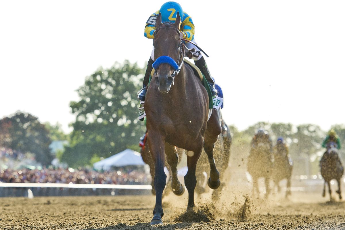 It’s no contest as American Pharaoh, with jockey Victor Espinoza, pulls away to win the Belmont Stakes, becoming the first Triple Crown winner since Affirmed. (Associated Press)