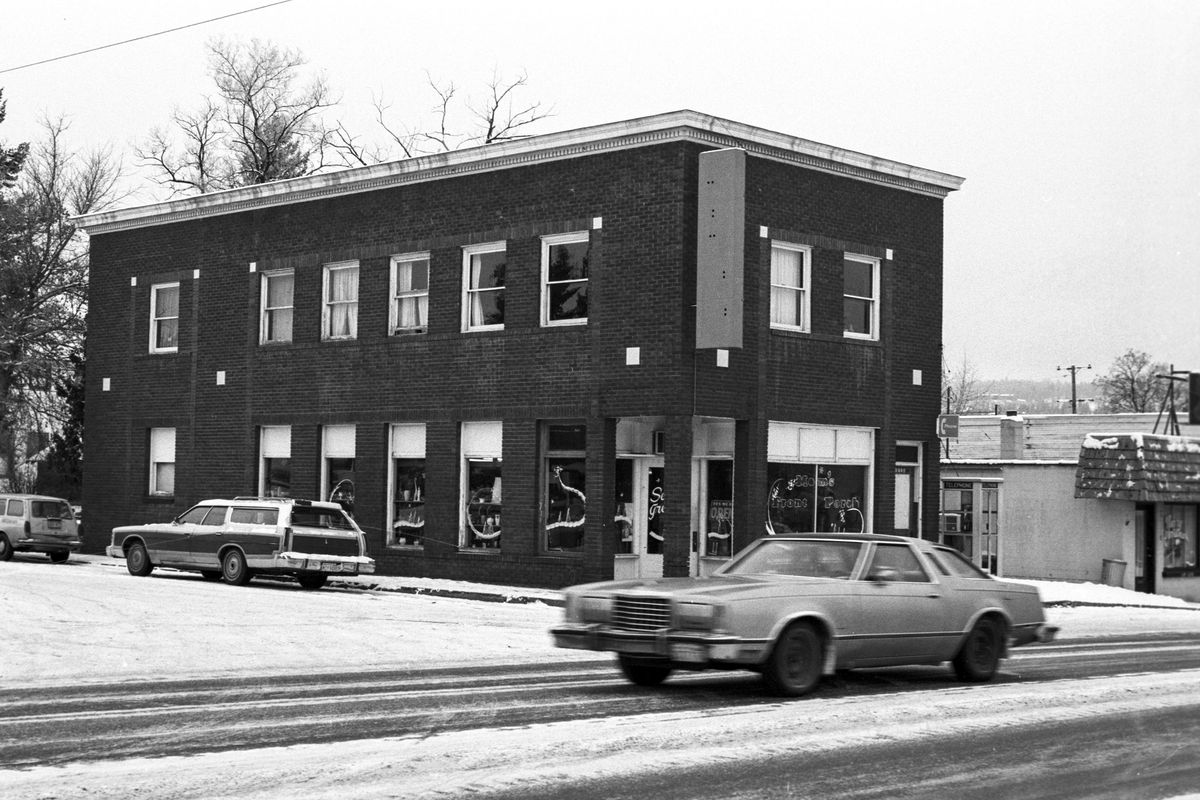 1976: The Brown Building was built in 1925 by George Brown in Millwood and housed the Tiffin Pharmacy, which went on to become the Millwood Pharmacy until it closed 50 years later. After it closed in 1976, it was an antique store for many years. In the early 1990s, the building was bought by Bobbie Beese and she and her siblings have operated the Corner Door Cafe there ever since. Beese and brother Greg Mott helped write the nomination for the National Register of Historic Places for the Millwood Historical District, which included the downtown commercial strip and many classic homes nearby. It was added to the National Register in 2001.   (WASHINGTON STATE DIGITAL ARCHIVES)