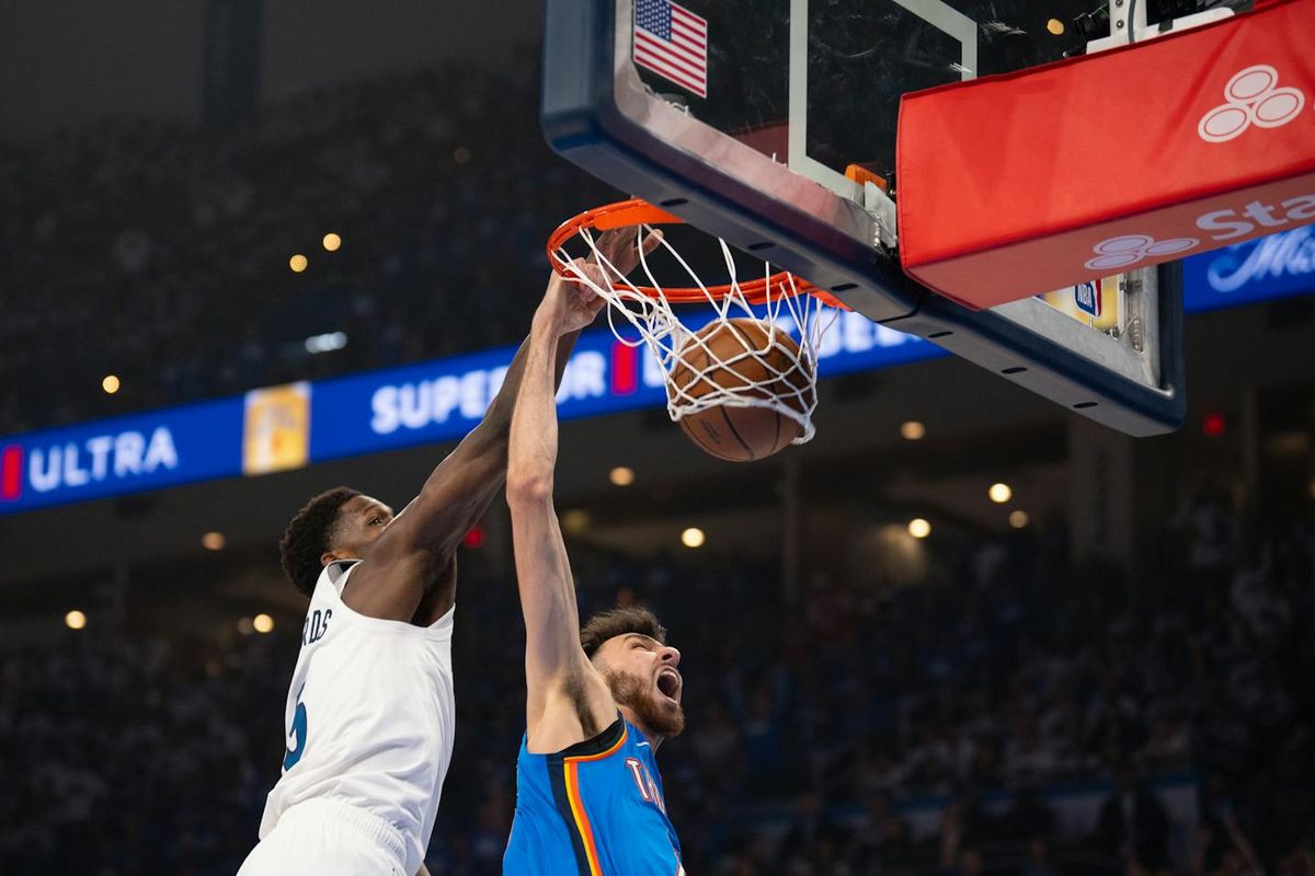Thunder forward Chet Holmgren (7) dunks while Timberwolves guard Anthony Edwards gets to the play late Wednesday night in Oklahoma City. (Jeff Wheeler / The Minnesota Star Tribune) (Jeff Wheeler)