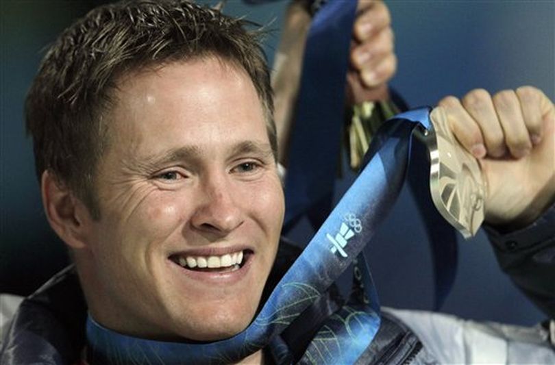 In this Feb. 26, 2010 file photo, Jeret Peterson, of the United States, holds his silver medal during the medals ceremony for the men's freestyle skiing aerials at the Vancouver 2010 Olympics in Vancouver, British Columbia. Utah police say Peterson has killed himself in an isolated canyon. The Unified Police of Greater Salt Lake said Peterson called 911 before shooting and killing himself on Monday evening, July 25, 2011. (AP Photo / Gerry Broome)