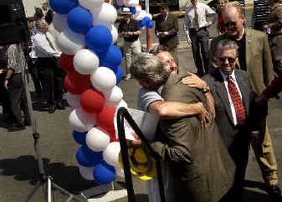 
Former Spokane Public Facilities District Chairman Shaun Cross, right, and PFD Executive Director Kevin Twohig exchange a hug as the long-awaited convention center expansion got under way Thursday. 
 (Brian Plonka/The Spokesman/Revie / The Spokesman-Review)