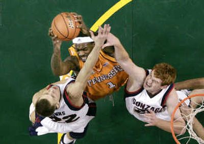 
Tennessee's Tyler Smith grabs a rebound between Gonzaga's Micah Downs and David Pendergraft in the first half.Associated Press
 (Associated Press / The Spokesman-Review)