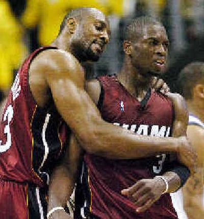 
Miami's Alonzo Mourning, left, put up solid numbers in relief of Shaquille O'Neal.
 (Associated Press / The Spokesman-Review)