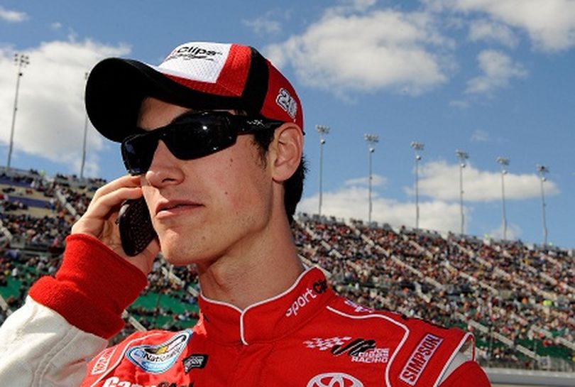 Joey Logano takes a call on pit road before starting the NASCAR Nationwide Series Kansas Lottery 300 on Saturday in Kansas City, Kan., in the pole position – his sixth of the 2010 season. (Photo courtesy of Jarrett/Getty Images for NASCAR) (Rusty Jarrett / Getty Images North America)