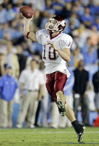 
Cougs quarterback Alex Brink fires off one of his 38 passes against UCLA. 
 (Associated Press / The Spokesman-Review)