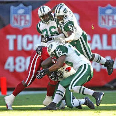 
New York's Reggie Tongue (25) and his Jets teammates will look to gang up on the Seattle Seahawks on Sunday. 
 (Associated Press / The Spokesman-Review)