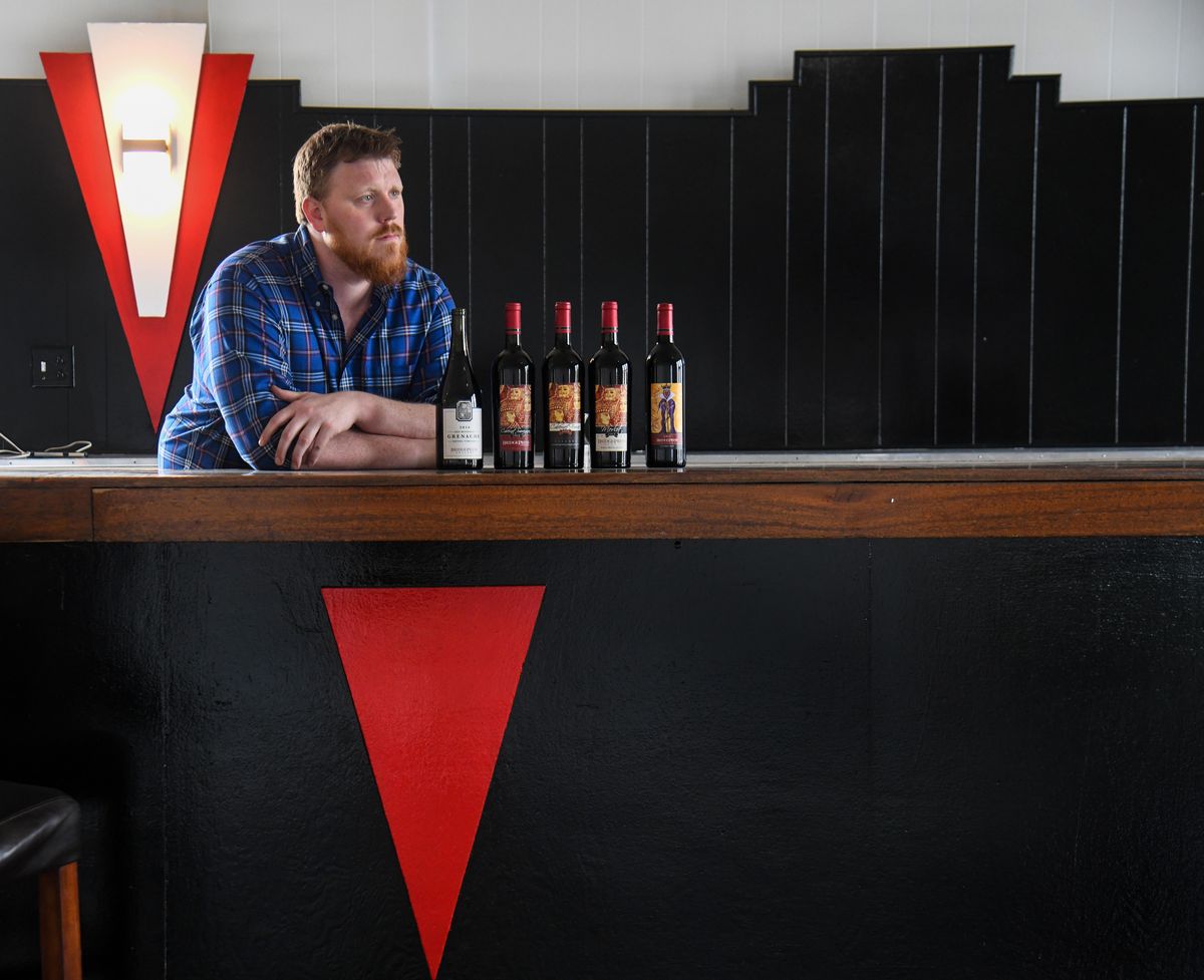Drew Padrta, of Bridge Press Cellars, pauses at his new Forbidden Bar in the events center, Thursday, May 2, 2019, in Spokane, Wash. (Dan Pelle / The Spokesman-Review)