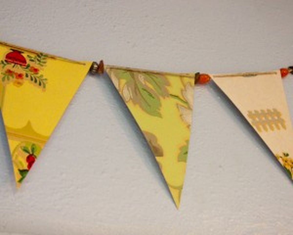 Recycled wrapping paper make a great bunting. (Courtesy of Crafting a Green World.)
