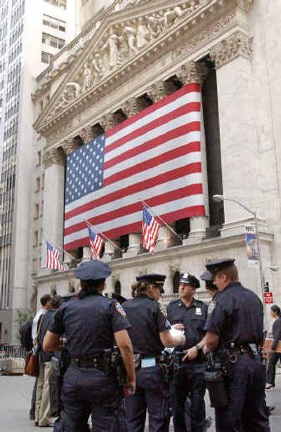 
New York City Police officers outside the New York Stock Exchange on Friday morning.
 (Associated Press / The Spokesman-Review)