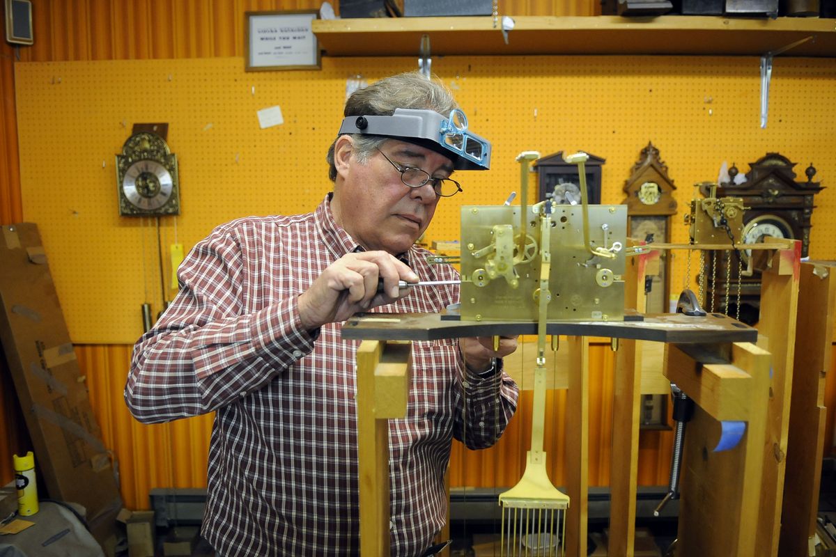Leo Tracy is helping to close Larsen’s Clock Center on East Third Avenue. Tracy worked for repairman and restorer David Larsen, who took over the shop from his father, William Larsen, in 1976 and ran it until shortly before his death in April. (Dan Pelle / The Spokesman-Review)