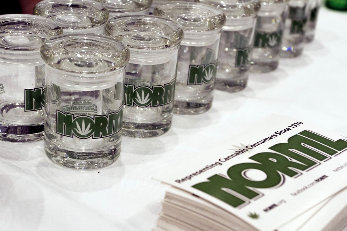 Glass marijuana containers bearing the logo for the National Organization for the Reform of Marijuana Laws, are displayed next to NORML promotional materials at the Cannabis World Congress and Business Exposition, Friday, June 17, 2016 in New York. (Ezra Kaplan / Associated Press)