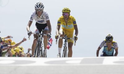 Andy Schleck, wearing the best young rider’s white jersey; Alberto Contador, wearing the overall leader’s yellow jersey; and seven-time Tour de France winner Lance Armstrong, left to right, cross the finish Saturday.  (Associated Press / The Spokesman-Review)
