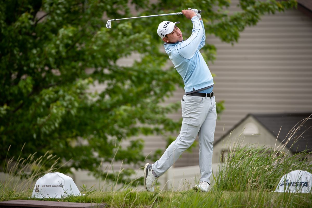 Li Wang hits a tee shot during a windy final round of the Lilac City Invitational on Sunday at the Fairways in Cheney. (Libby Kamrowski/The Spokesman-Review)