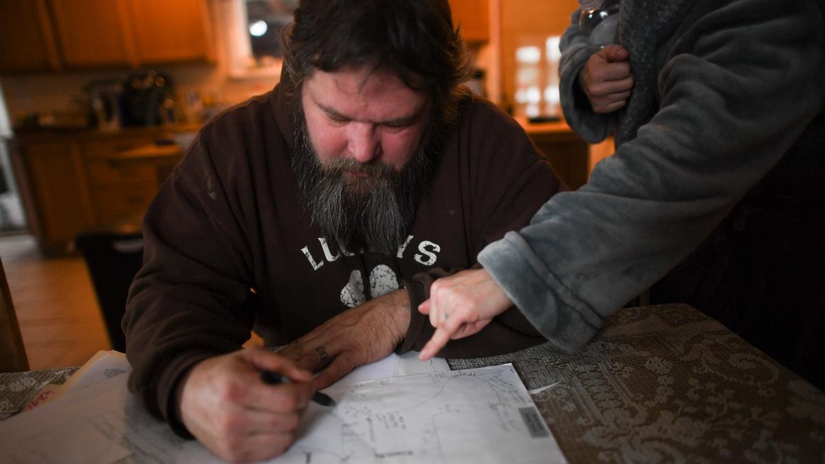 Aaron Inman and his wife Ericka show the route where they are detoured after officials closed the Euclid Bridge. (Tyler Tjomsland / The Spokesman-Review)