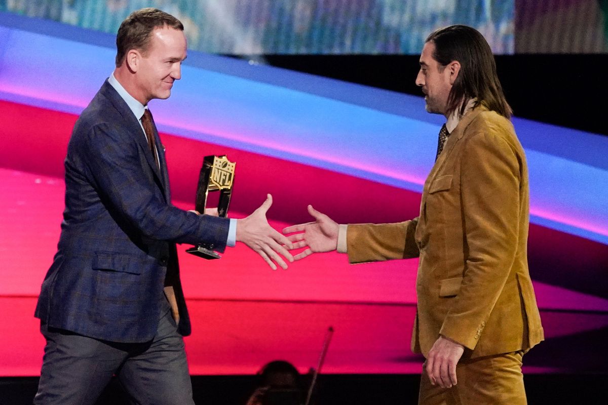 Payton Manning gives the AP Most Valuable Players of the Year Award to Aaron Rodgers, right, of the Green Bay Packers at the NFL Honors show Thursday, Feb. 10, 2022, in Inglewood, Calif. (Mark J. Terrill)