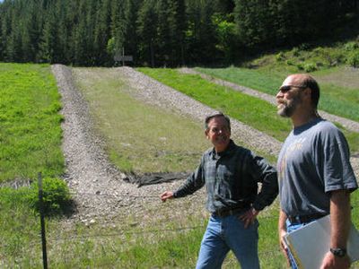 
Steve McGeehan, a soil scientist and analytical chemist at the University of Idaho, right, and the Idaho Department of Environmental Quality's Nick Zilka visit the mine reclamation test plots Wednesday  near Osburn, Idaho.
 (James Hagengruber / The Spokesman-Review)