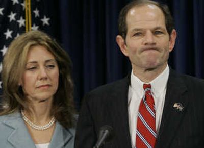 
New York Gov. Eliot Spitzer, joined by his wife, Silda, makes a statement to reporters Monday. Associated Press
 (Associated Press / The Spokesman-Review)