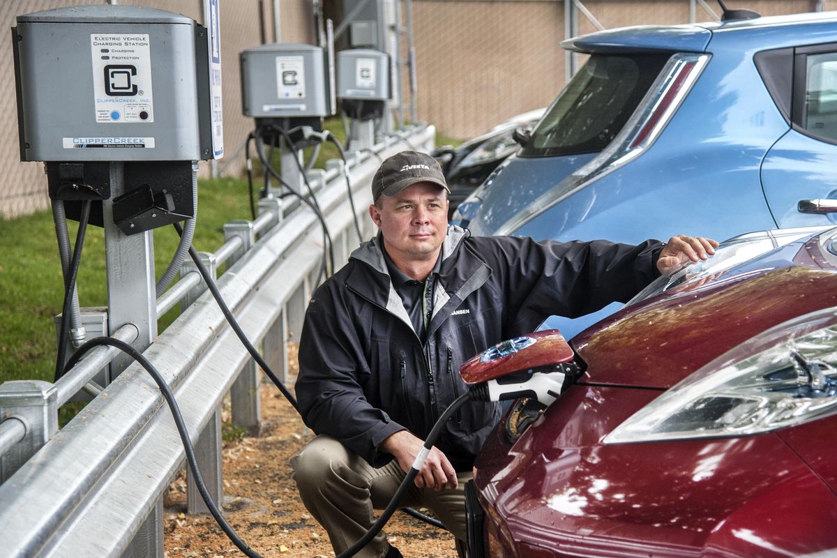 Rendall Farley is in charge of Electrification and Transportation Initiatives at Avista. He bought a used Nissan Leaf to better understand consumer car use. Avista is installing chargers at homes, workplaces and public places as part of a pilot program starting in August. The utility wants to start collecting information about how electric cars could affect their load in the future. (Dan Pelle / The Spokesman-Review)