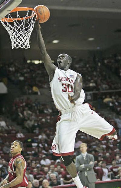 
Longar Longar, who leads OU's frontline, goes to the hoop against Arkansas  Saturday.  Associated Press
 (Associated Press / The Spokesman-Review)